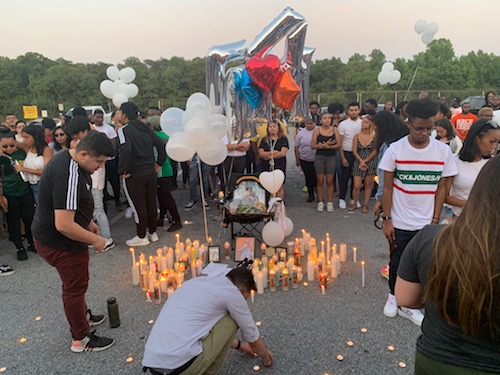 A candlelight vigil is held on July 12 at Parkdale High School in Riverdale, Md., for Morgan State University student and Parkdale alumnus Manuel Luis Jr., 19, who was fatally shot outside his Baltimore apartment the previous day. (Hamil R. Harris/The Washington Informer)