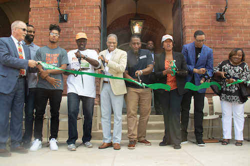 From right: Coolidge Senior High School Principal Samantha Bright, D.C. Public Schools Chancellor Lewis Ferebee, Mayor Muriel Bowser, D.C. Department of General Services Director Keith Anderson, Ward 4 Council member Brandon Todd and Coolidge Alumna President Terry Goings join Ward 4 residents and supporters to cut the ribbon on the newly renovated high school and adjacent Ida B. Wells Middle School in Northwest on Aug. 24. (Shevry Lassiter/The Washington Informer)