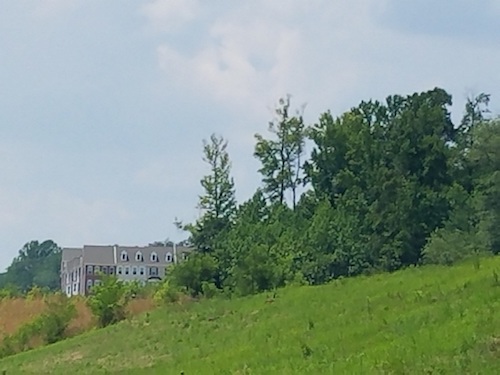 A proposal to use property in Upper Marlboro, shown here in July, for a merchandise logistics center has been withdrawn. In the background are townhomes at Westphalia Town Center. (William J. Ford/The Washington Informer)
