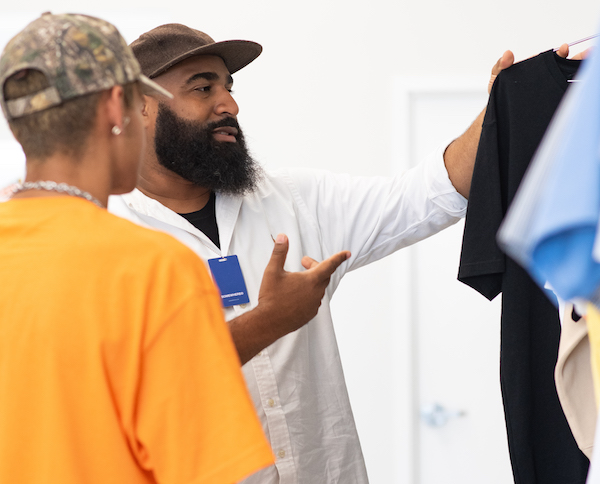 Dominick "Dom" Adams (right), co-owner and founder of Somewhere (Photo by Jordan Barnes)