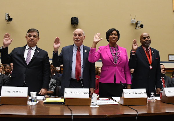 From left: D.C. Chief Financial Officer Jeffrey DeWitt, D.C. Council Chairman Phil Mendelson (D), Mayor Muriel Bowser (D) and District veteran Kerwin Miller are sworn in to testify at Sept. 19 hearing on Capitol Hill for the District to become the nation's 51st state. (Roy Lewis/The Washington Informer)