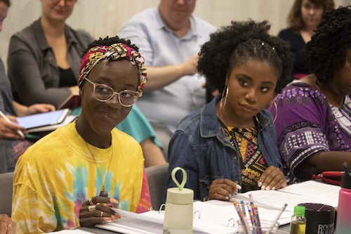 Moriamo Temidayo Akibu Gifty (left) and Debora Crabbe, cast members in Round House Theatre production of "School Girls; or the African Mean Girls Play" take part in a rehearsal. (Kaley Etzkorn/Round House Theatre)