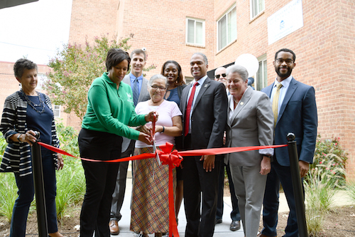 On the morning of Sept. 26, D.C. Mayor Muriel Bowser (D), Ward 4 Council member Brandon Todd (D), and others celebrated the preservation of affordable housing at a ribbon-cutting ceremony for the newly renovated Fort Stevens Place. (Anthony Tilghman/The Washington Informer)
