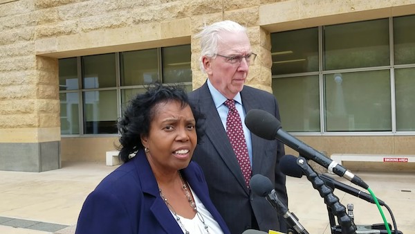 Former Maryland Del. Tawanna Gaines, joined by her attorney, William Brennan Jr., speaks to reporters on Oct. 17 after she was arraigned in U.S. District Court in Greenbelt on a federal wire fraud charge. (William J. Ford/The Washington Informer)