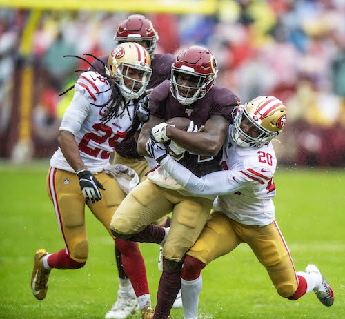 Washington Redskins running back Wendell Smallwood is tackled by San Francisco 49ers cornerback Jimmie Ward during the 49ers' 9-0 win at FedEx Field in Landover, Md., on Oct. 20. (Photo by Yusuf Abdullah)