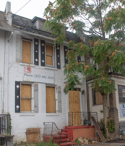 A fire at 708 Kennedy Street NW on Aug. 18 that killed a man and an elementary school student revealed lapses in the Department of Consumer and Regulatory Affairs' building inspection process. (Shevry Lassiter/The Washington Informer)