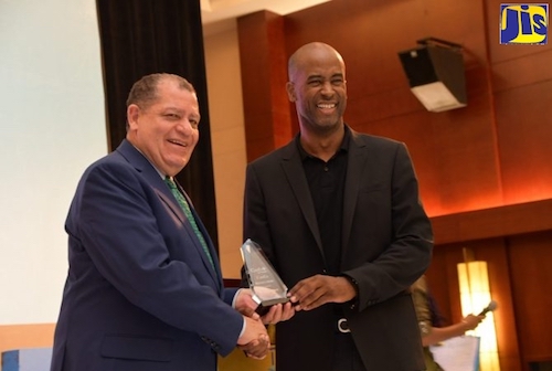 e Hon. Audley Shaw (left), Minister of Industry, Commerce, Agriculture and Fisheries, accepts the Maverick Award from Founder of the CanEx Business Conference and Expo, Douglas Gordon, during the opening ceremony of the event at the Montego Bay Convention Centre on September 26. (Courtesy photo/Serena Grant)