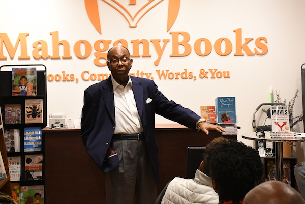 Multimillionaire entrepreneur William Pickard chats with Mahogany Books co-owner Derrick Young. (Roy Lewis/The Washington Informer)