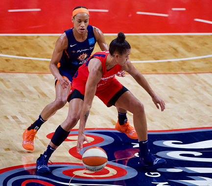Washington Mystics guard Natasha Cloud protects the basketball while defended by Connecticut Sun guard Jasmine Thomas during the Sun's 99-87 victory in Game 2 of the WNBA Finals at the Entertainment and Sports Arena in southeast D.C. on Oct. 1. (Photo by Yusuf Abdullah)