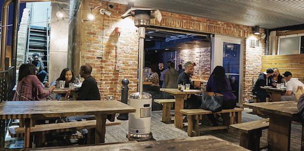 The upper decks at Smith Commons provide an intimate space to dine and drink on H Street NE. (Photo by Forrest Givens)
