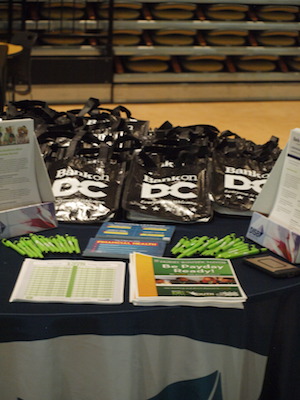 DC's Department of Insurance, Securities, and Banking partnered with H.D. Woodson High School to introduce financial literacy to 11th and 12th grade students. They passed out Bank on DC bags and pens to students. (Shantella Y. Sherman/The Washington Informer)