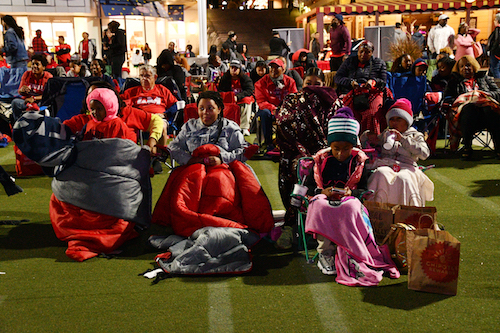 Dozens of Washington Mystics fans flock to National Harbor on Oct. 8 to watch Game 4 of the WNBA Finals. (Anthony Tilghman/The Washington Informer)