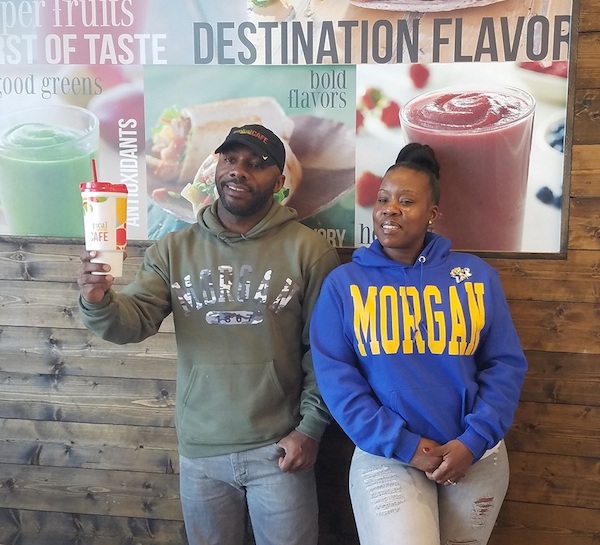 David Magby (left) and Alesha Hicks pose for a photo Nov. 11 at the Tropical Smoothie Café in Temple Hills, which they established last year. The couple aims to open a second café. (William J. Ford/The Washington Informer)