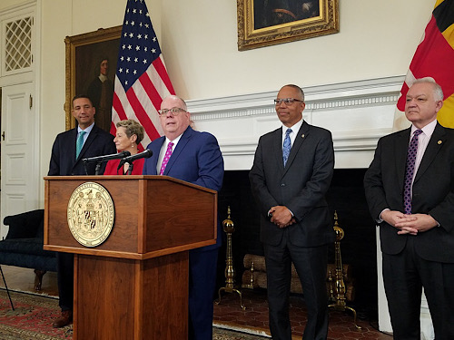 Maryland Gov. Larry Hogan (at lectern) announces two pieces of proposed legislation for school construction and accountability during a press conference Dec. 5 in Annapolis. Behind him are (from left) his chief legislative officer Keiffer Mitchell, state Superintendent Karen Salmon, Lt. Gov. Boyd Rutherford and Hogan’s budget secretary David Brinkley. (William J. Ford/The Washington Informer)