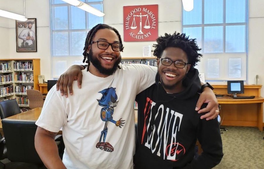 hurgood Marshall Academy mentor Shelton, who works with student Barry, is among the volunteers at the heart of work at the Southeast school. (TMA photo)