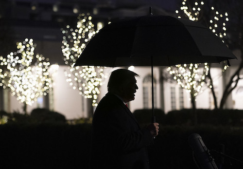 President Trump is seen in silhouette holding an umbrella as he talks to members of the press on the South Lawn of the White House on Dec. 10, 2019. (Joyce N. Boghosian/The White House)