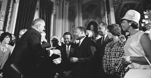 President Lyndon B. Johnson meets with Martin Luther King Jr. at the signing of the Voting Rights Act of 1965 on Aug. 6, 1965. (Lyndon Baines Johnson Library and Museum via Wikimedia Commons)