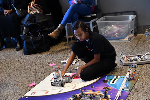 Leah Tadege, a fifth grader and National Society of Black Engineers (NSBE) junior, plays with engineering modules during Science, Technology, Engineering and Math (STEM) Day at the National Museum of African American History and Culture in D.C. on Feb. 22. (Anthony Tilghman/The Washington Informer)