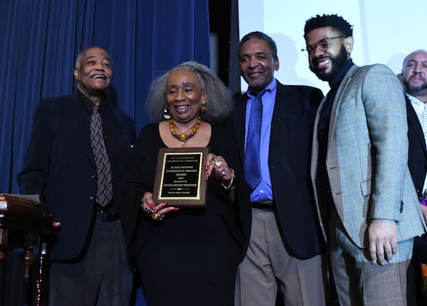 From left: DC Black History Celebration Committee Director Chuck Hicks presents the Black History Community Service Award to Sandra Butler-Truesdale with African American Civil War Museum founder Frank Smith and Aaron Holmes present during an event at the museum in northwest D.C. on Feb. 1, 2020. (Roy Lewis/The Washington Informer)