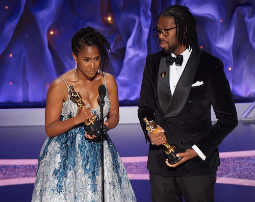 Sony Executive Karen Rupert Toliver and producer Matthew A. Cherry accept the Oscar for Best Animated Short Film on Feb. 9 at the 92nd Annual Academy Awards in Los Angeles. (Courtesy of Troy Harvey)
