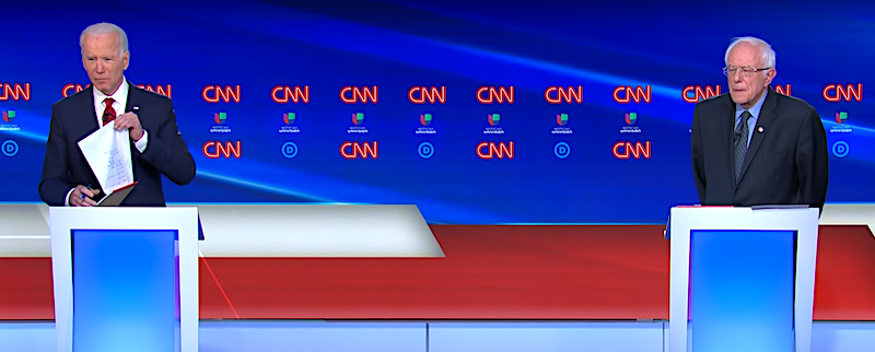 Democratic presidential hopefuls Joe Biden (left) and Bernie Sanders participate in a candidate debate at CNN studios in Washington, D.C., on March 15.
