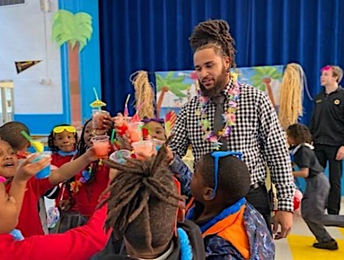 James Bonnette conducts daily check-ins with scholars, encouraging them to have a good day and to be positive role models for their peers at Achievement Prep Public Charter School. (Courtesy of Achievement Prep PCS)