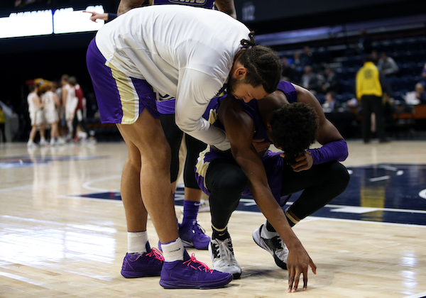 James Madison University players react to losing in the first round of the 2020 CAA tournament after falling to Elon University 63-61 on March 7. (Daniel Kucin Jr./The Washington Informer)