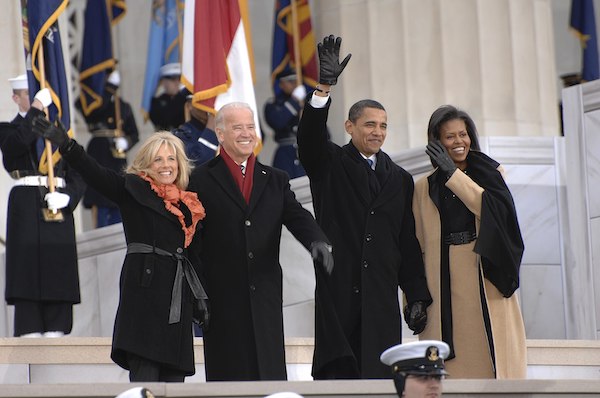 **FILE** Jill Biden, left, Vice President-elect Joe Biden, President-elect Barack Obama, and Michelle Obama wave to the crowd gathered at the Lincoln Memorial on the National Mall in Washington during the Inaugural opening ceremonies. More than 5,000 men and women in uniform are providing military ceremonial support to the 2009 Presidential Inauguration, a tradition dating back to George Washington's 1789 Inauguration. (U.S. Navy photo by Mass Communication Specialist 2nd Class George Trian/Released)