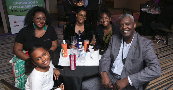 NNPA Senior Correspondent Stacy M. Brown (right), wife Shenay (third from left) and family (Courtesy of NNPA Newswire)
