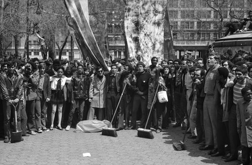 Earth Day celebrations in Union Square Park included clean up crews composed of school children. Con Edison, often criticized for their environmental policies, donated brooms, mops and other supplied for the cause. Other events in the park included Frisbee games and a massive plastic bubble filled with "fresh air." (Courtesy of the Archives of New York City)