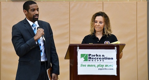 Prince George's County school board member Bryan Swann (left) speaks with residents during a District 5 town hall session at Palmer Park Community Center on Feb. 8, hosted by County Council member Jolene Ivey (right). (Anthony Tilghman/The Washington Informer)