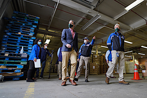 **FILE** Virginia Gov. Ralph Northam tours a Virginia Emergency Support Team warehouse on May 14. (Courtesy of the governor's office via Twitter)