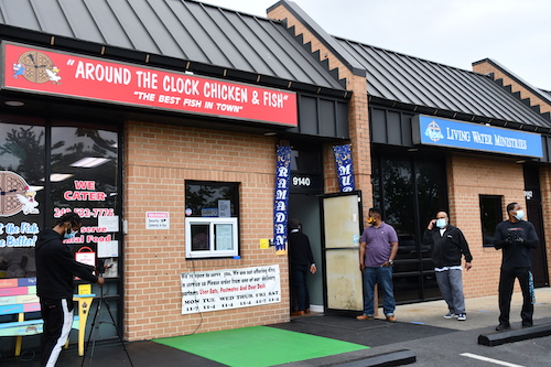 Iman Yahya Muhammad and wife Olonda, owners of Around the Clock Chicken and Fish in Capitol Heights, Maryland, provide free meals during the coronavirus pandemic on May 21. (Anthony Tilghman/The Washington Informer)
