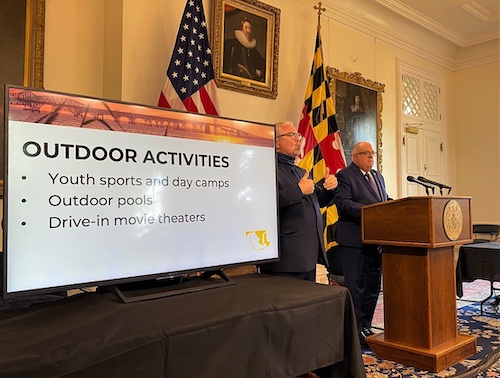 Maryland Gov. Larry Hogan (right) speaks during a May 27 press conference in Annapolis to announce additional easing of coronavirus-related restrictions in the state. (William J. Ford/The Washington Informer)