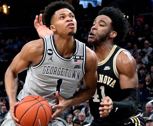 **FILE** Georgetown guard Jamorko Pickett is pressured by Villanova forward Saddiq Bey during Villanova's 70-69 win at Capital One Arena in northwest D.C. on March 7. (John E.. De Freitas/The Washington Informer)