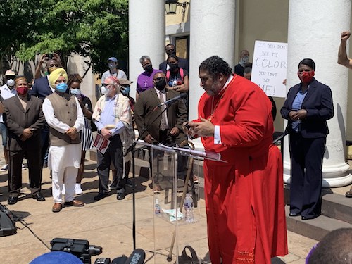 Rev. William J. Barber II, Poor People's Campaign co-chair, speaks during a prayer vigil outside St. John's Episcopal Church in D.C. on June 14. (Hamil R. Harris/The Washington Informer)