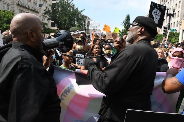 Demonstrators take to the streets to protest police brutality and racial inequality in the wake of the death of George Floyd, a Black man who died in Minneapolis while in police custody. (Roy Lewis/Trice Edney News Wire)
