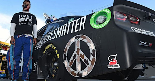 NASCAR driver Bubba Wallace stands on pit row at Martinsville Speedway in Ridgeway, Virginia. (Courtesy of NASCAR via NNPA Newswire)