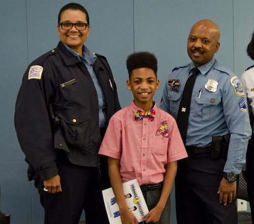 Miguel Coppedge (center) and MPD Officers Natali Thomas and Kip Coleman, whose friends and helped to inspire the story "Friendly Officers" by Coppedge. (Photo by Yolanda Coppedge)
