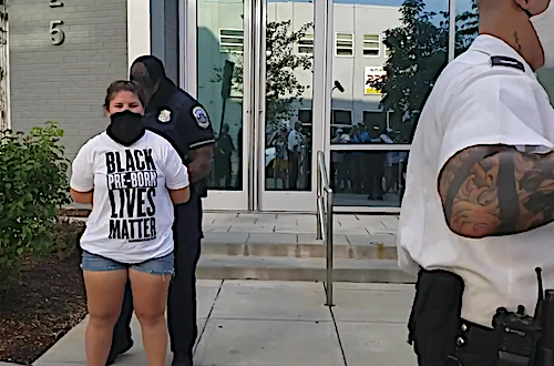 A video posted online by pro-life organization Students for Life of America purportedly shows two of its members being arrested by D.C. police for chalking pro-life messages on the sidewalk outside a Planned Parenthood facility.