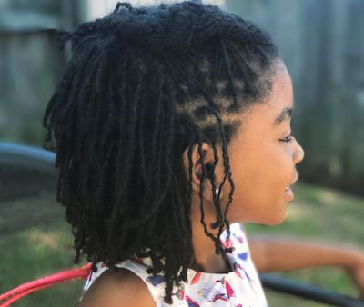 A young girl shows off her stylish locs. (Courtesy photo)