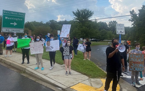 **FILE** Ashanti Martinez (right, with bullhorn) participates in a protest against police brutality and other forms of racism in Greenbelt on July 6. (Anthony Tilghman/The Washington Informer)