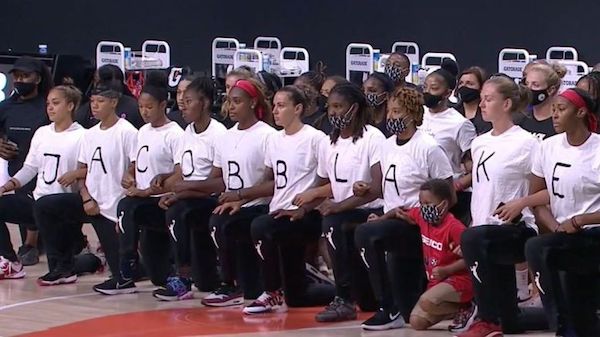 The WNBA Mystics shirts spelled out the name of Jacob Blake in the front and seven fake bullet holes in the back to protest the shooting of Blake who was shot seven times in the back by police in Kenosha, Wisconsin. (Courtesy photo)