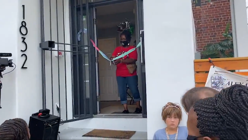 In this screen shot of a video posted online by arcgis.com, residents of D.C.'s Ivy City community gather on Sept. 12 to celebrate the opening of the Ivy City Club House.