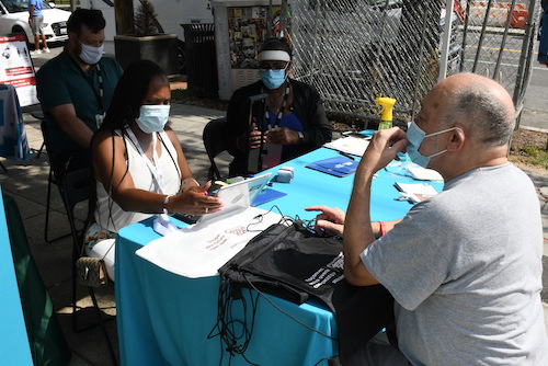 Philip Pannell, executive director of the Anacostia Coordinating Council (ACC), speaks with census volunteers and staff during a ACC census count initiative in southeast D.C. on Sept. 8. (Roy Lewis/The Washington Informer)
