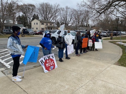 Carlene James (second from left) joins Robert Goddard Montessori School parents, students and alumni at a March 17 rally in front of the Prince George's County Public Schools' administration building. (William J. Ford/The Washington Informer)