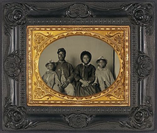 Unidentified African American soldier in Union uniform with wife and two daughters (Library of Congress via Smithsonian)