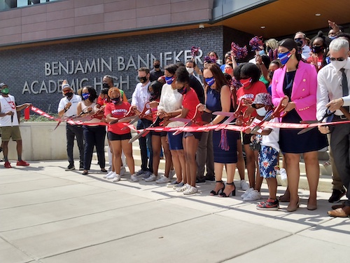 Principal Anita Berger, D.C. Mayor Muriel Bowser and bevy of public officials and community members cut the ribbon for the new Banneker Academic High School on Aug. 28. (Sam P.K. Collins/The Washington Informer)