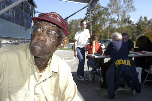 **FILE** A Swan Quarter resident waits at the FEMA disaster relief center after Hurricane Isabel. (Cynthia Hunter/FEMA News)