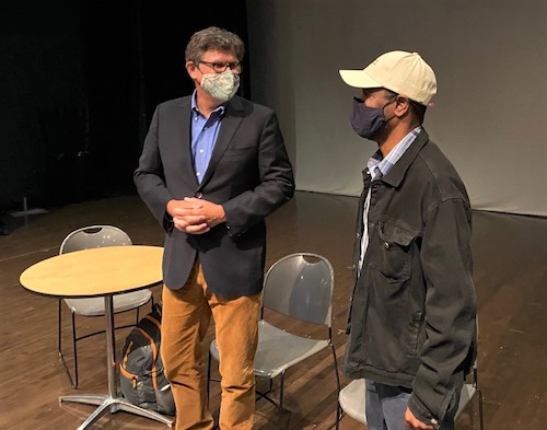 William G. Thomas III (left) and Psalmayene 24 chat at Joe's Movement Emporium in Mount Rainier, Maryland, on Sept. 9. Both will participate in a project to highlight the legacy of slavery in the United States. (William J. Ford/The Washington Informer)